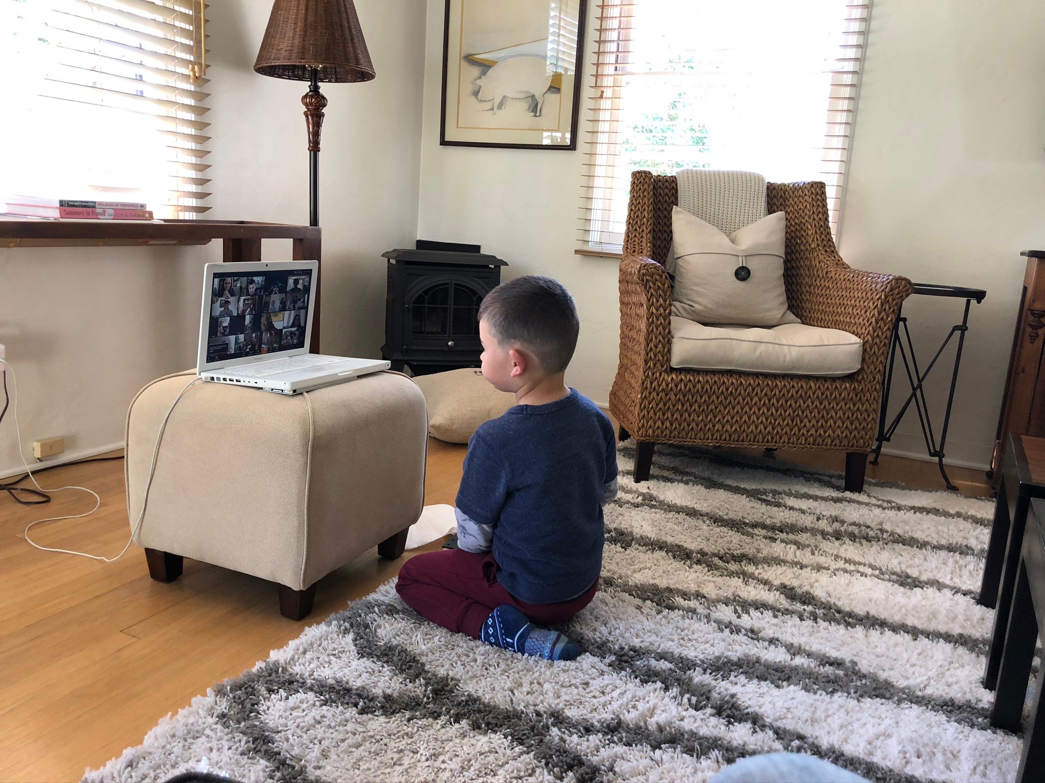 Mustang Media Group awards 2019 Preschool student Edro sits in front of a laptop during one of the Preschool Learning Lab's virtual sessions. Courtesy of Peggy Osborn