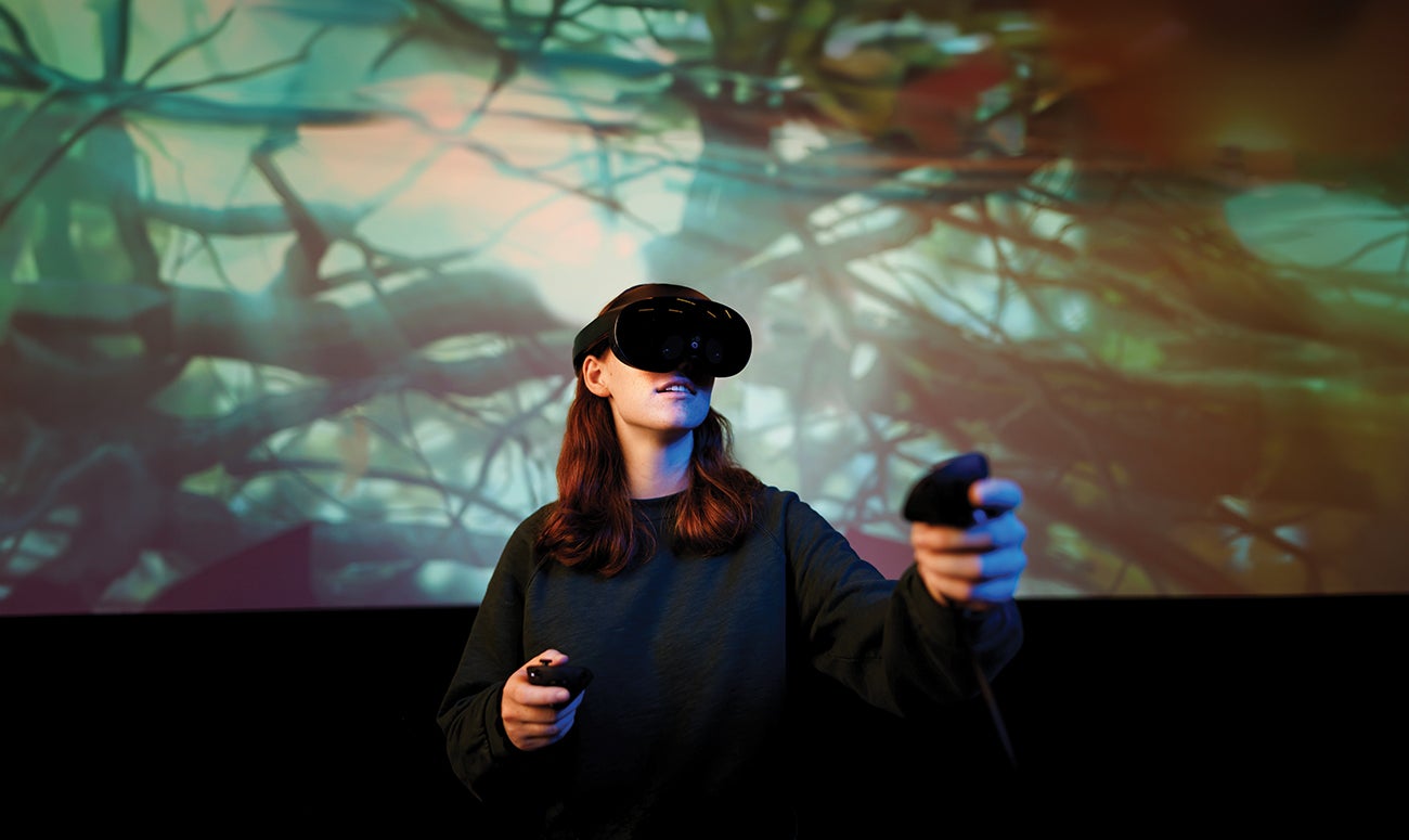 Student Alyse Murray tests out the studio’s virtual reality gear.