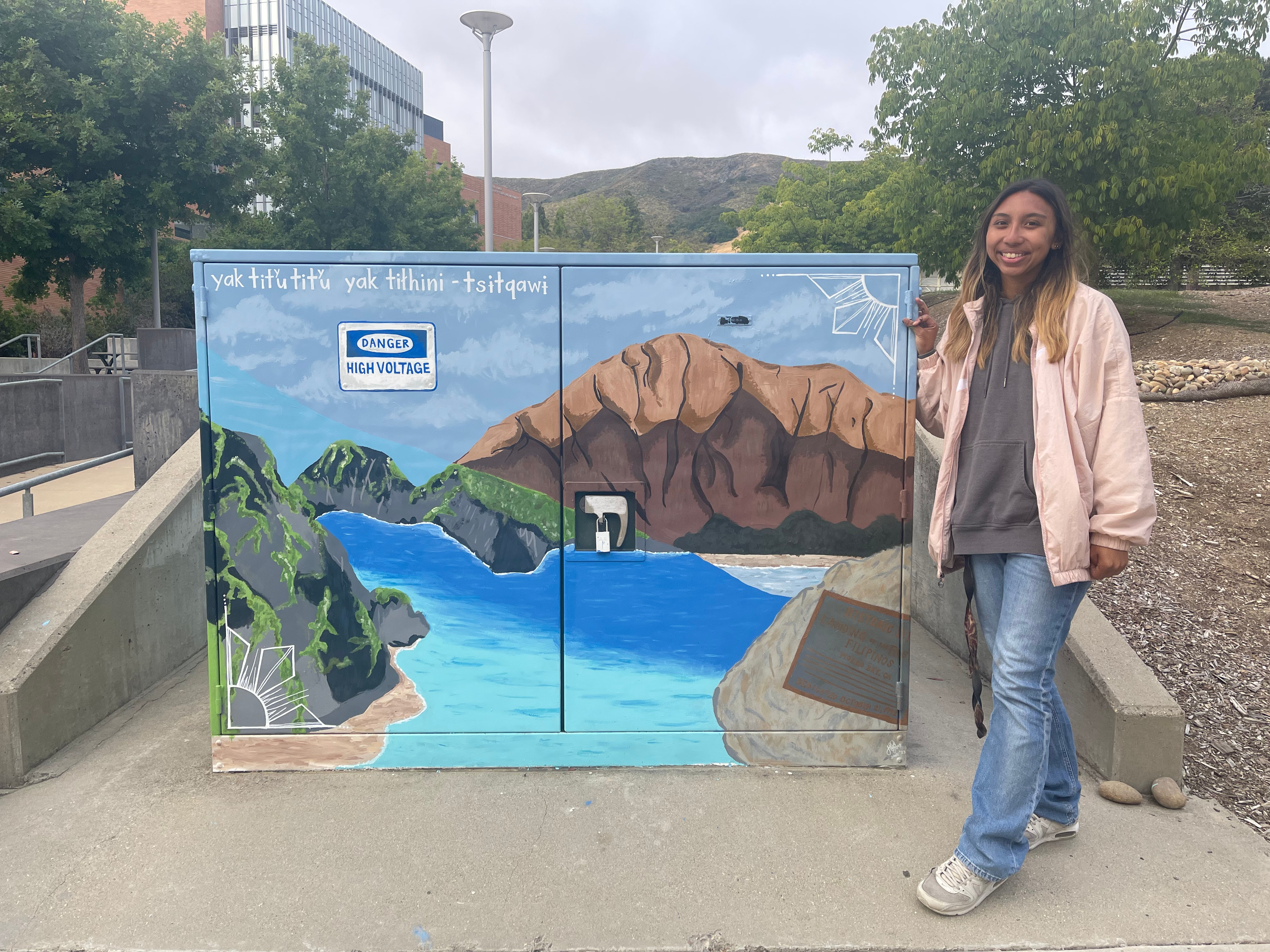 Halle Gotico and her completed utility box mural