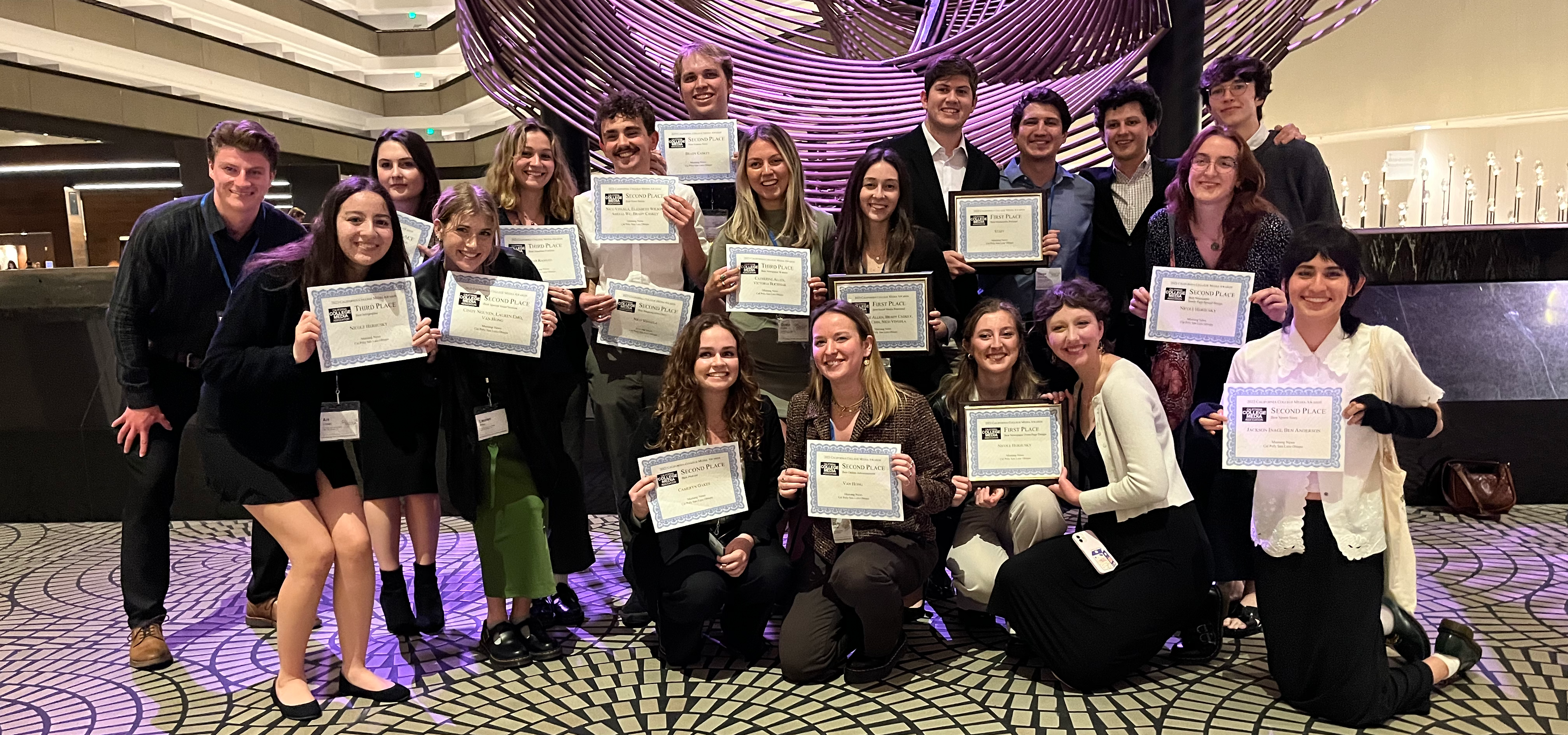 Mustange Media Group members pose with their award certificates.