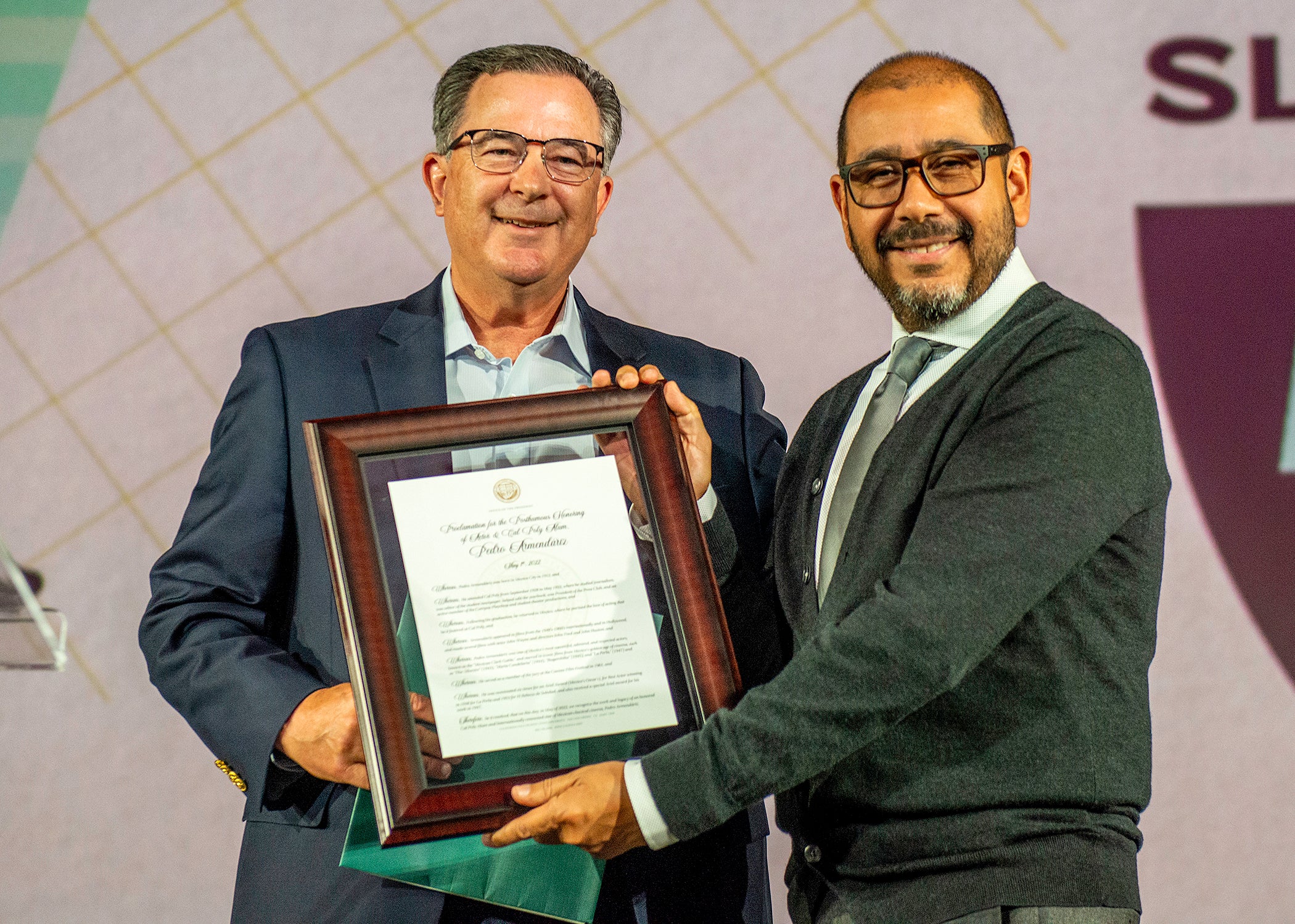 Dean Phillip Williams presenting an award to Pedro Armendáriz