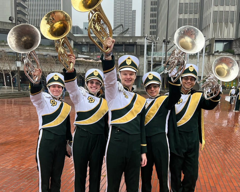 Nate and friends in the Mustang Band horns section proudly show their instruments.