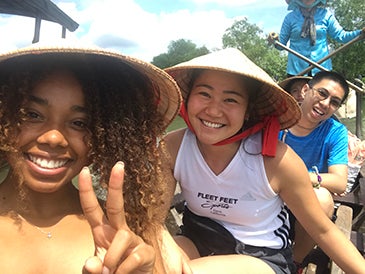 Mizuki (center) on a boat tour exploring the Mekong Delta.