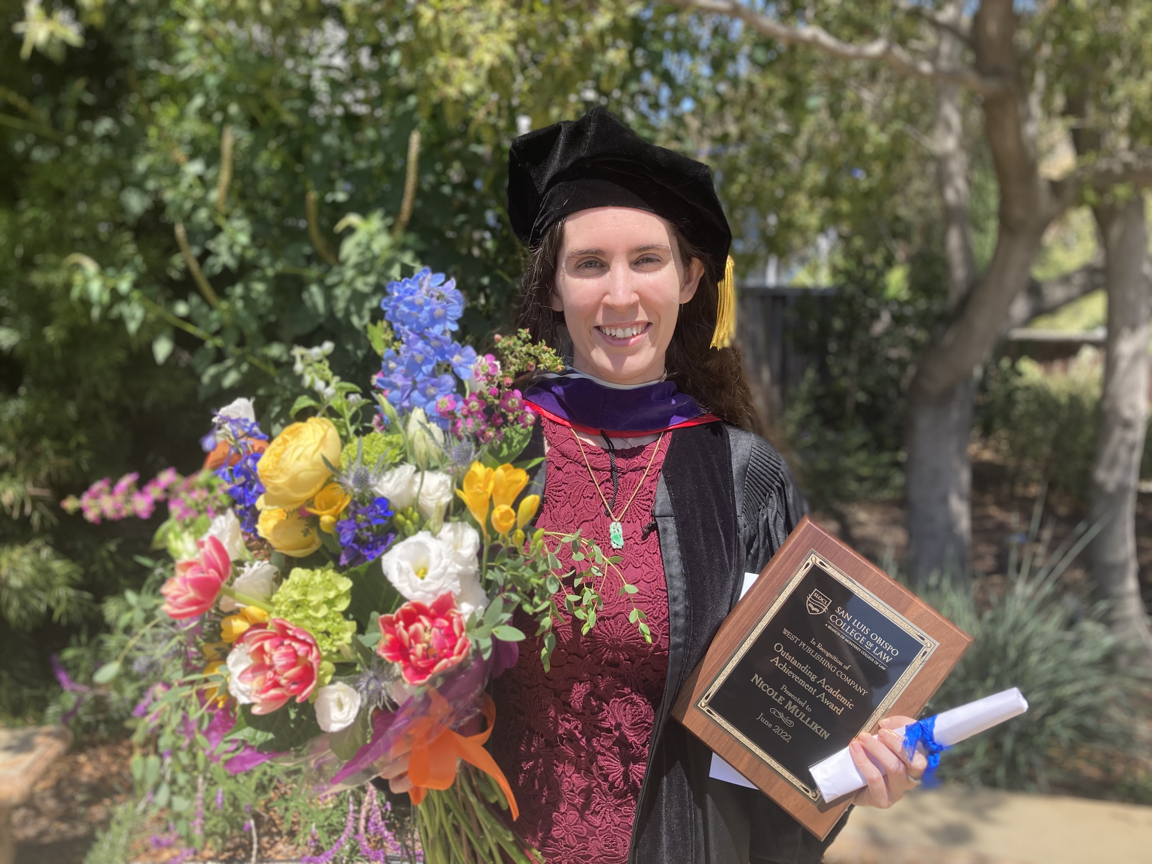 Example of an image that is floated to the left side Nicole Mullikin posing at her graduation
