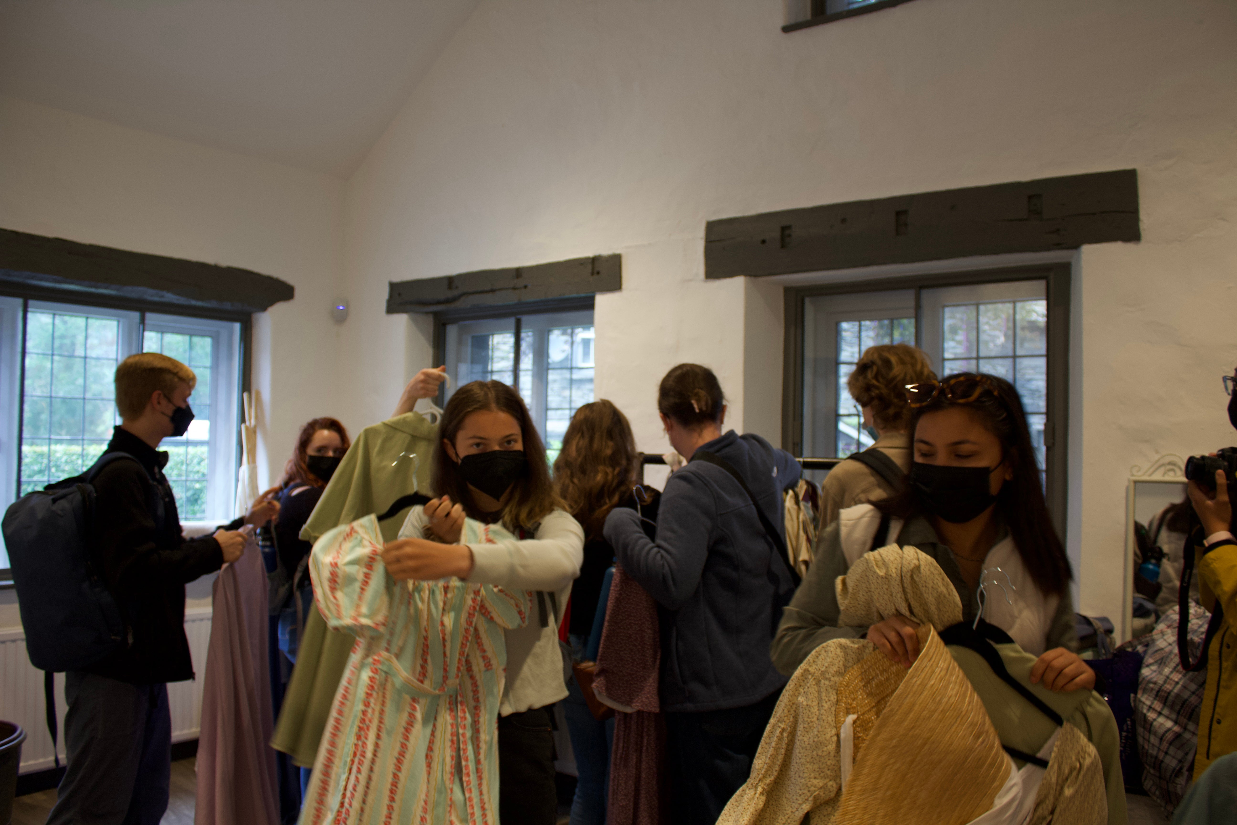 Students examine period costumes