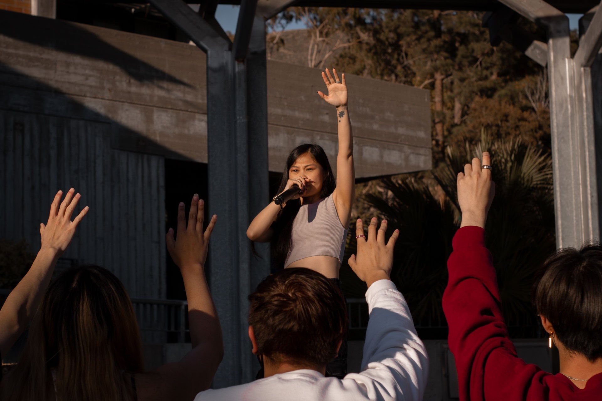 Ruby Ibarra, with her left hand up, encouraging the crowd to put their hands up Ruby Ibarra, with her left hand up, encouraging the crowd to put their hands up