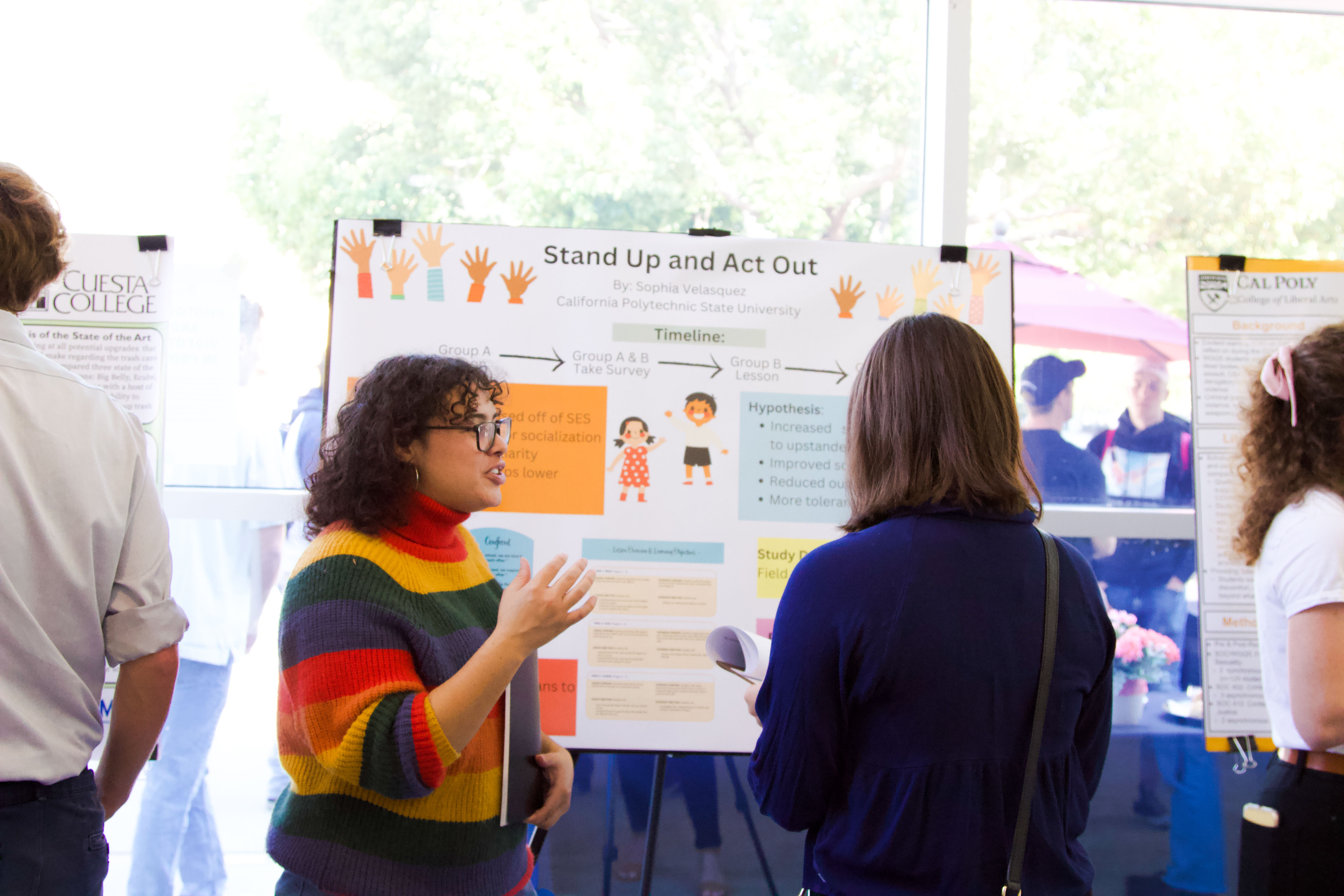 Sophia Velasquez presents her poster at the 2022 SURP+ Symposium.