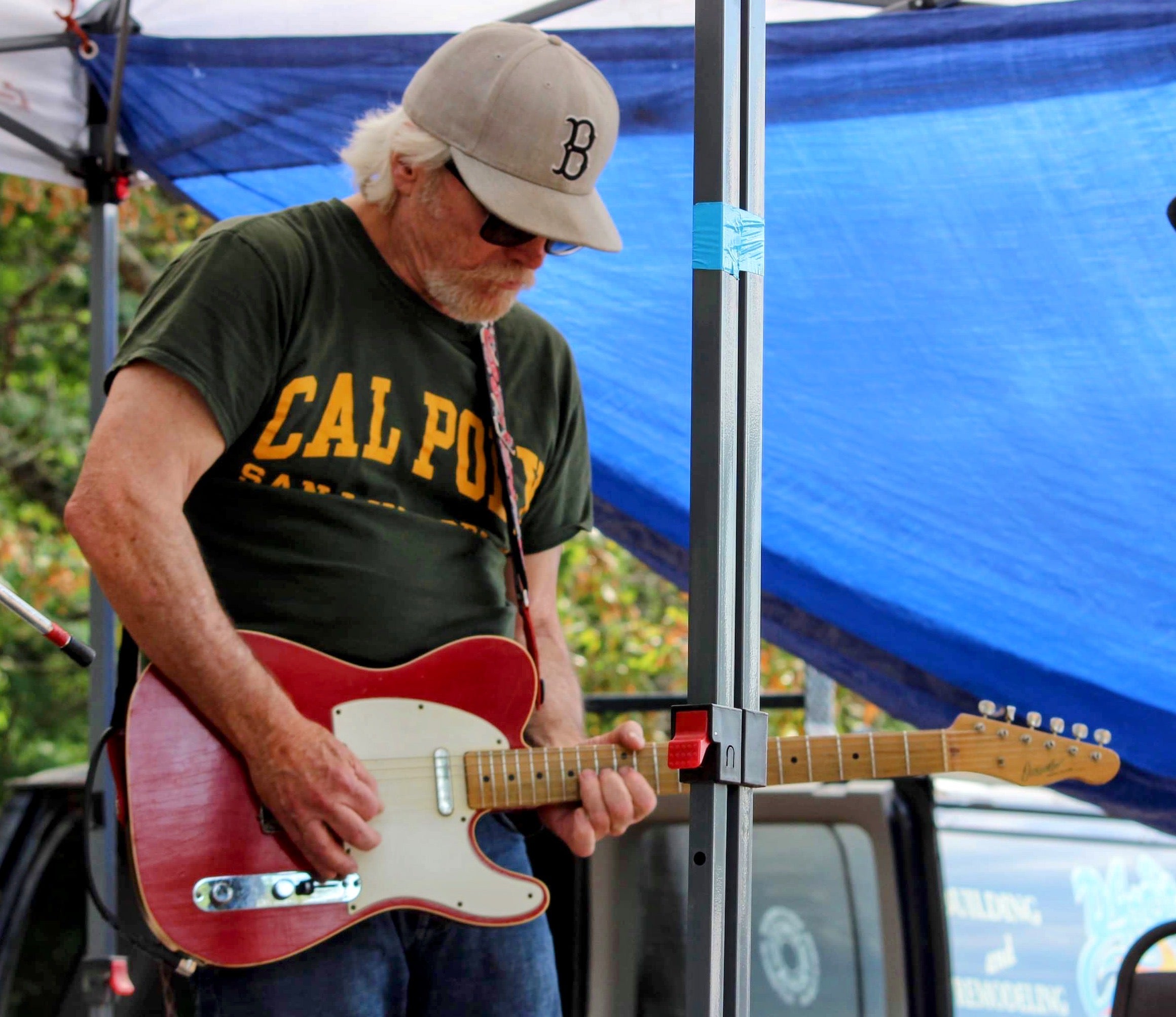 Mike Griffith performing wearing a Cal Poly t-shirt