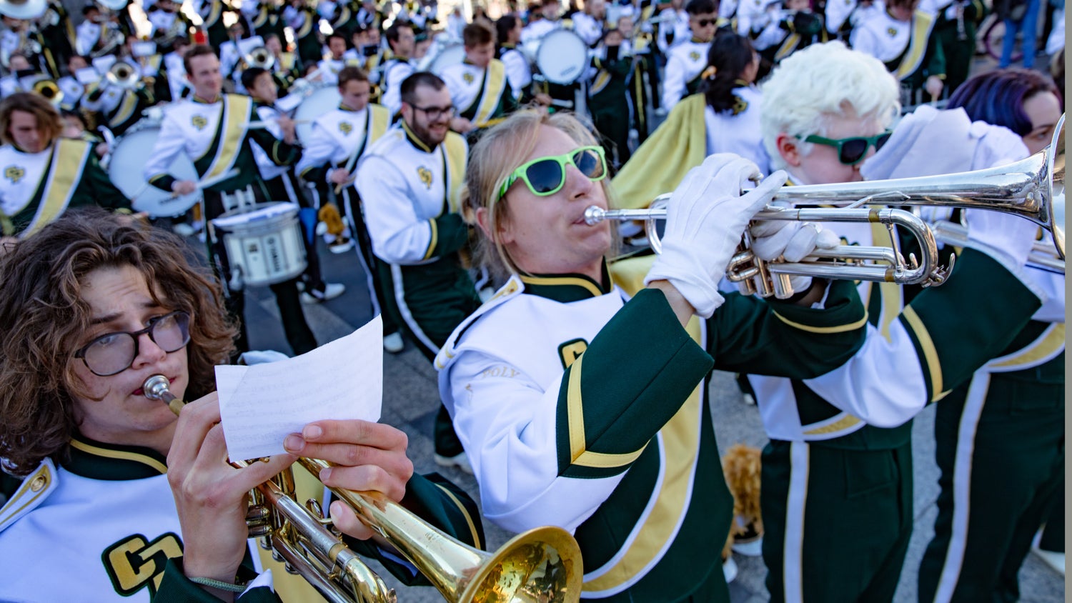 Example of an image that is floated to the left side Members of the Mustang Band jam in front of the Ferry Building before the start of the Chinese New Year Parade.