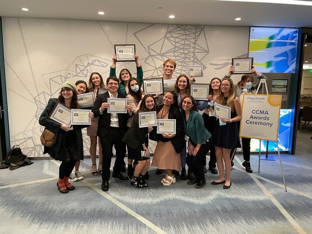 Cal Poly Spanish Debate Team Students posing with their awards