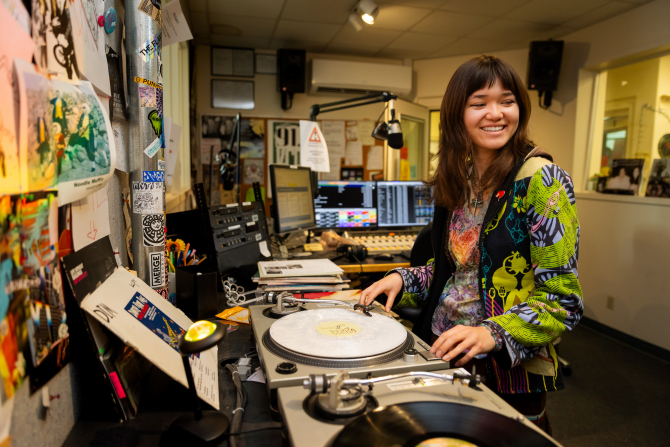 DJ smiling while making music. 