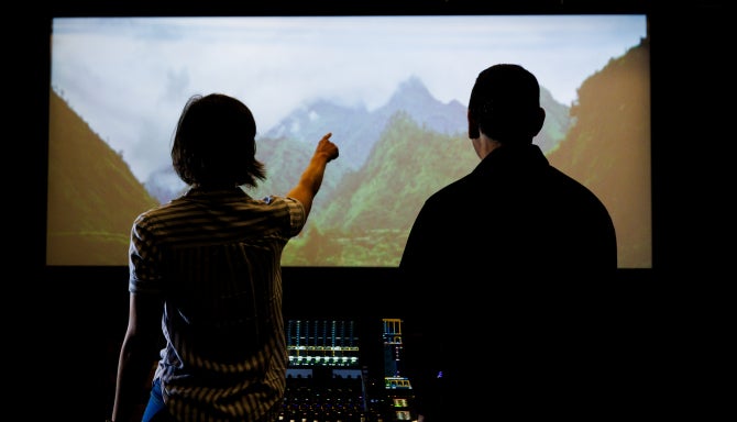 Woman pointing at screen