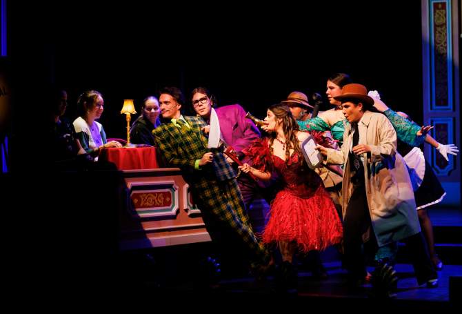 Group of people acting in a play. 