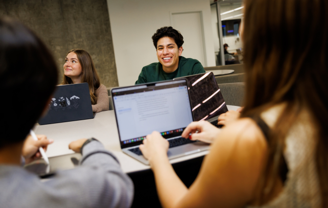 Students working with laptops in Kennedy Library