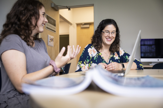 Dr. Lauren kolodziejski working with student