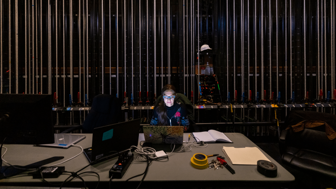 Student backstage of a Cal Poly theatre production
