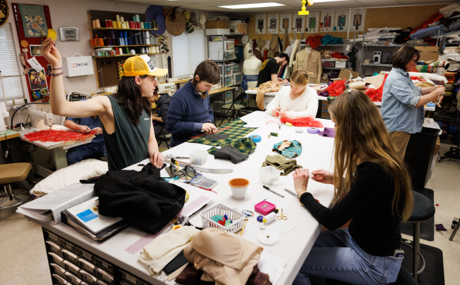 Students work on making the costumes for their winter production of Clue: The Musical.