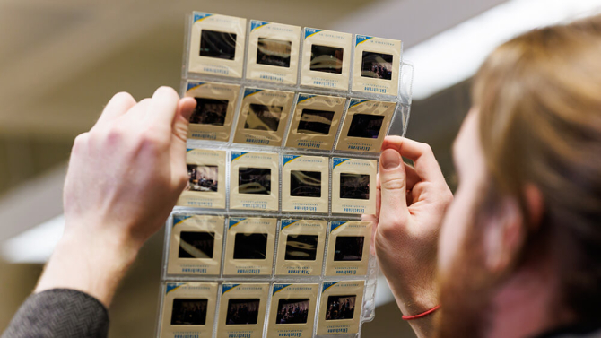 Researcher examining historical images