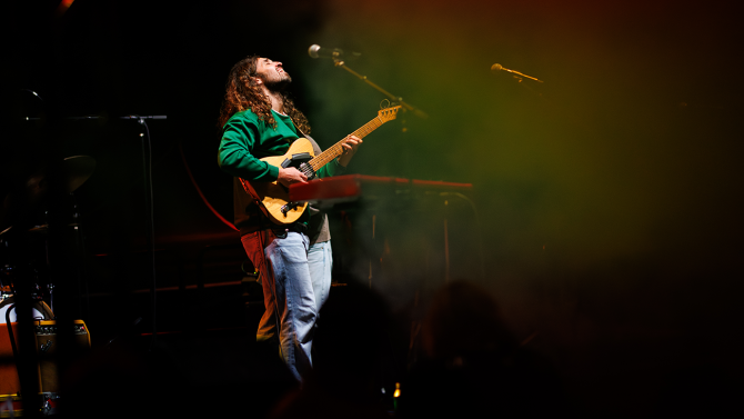 Musician on a stage during Week of Welcome
