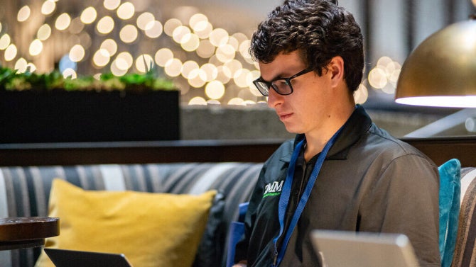 Student working on a laptop at Mustang Media Group