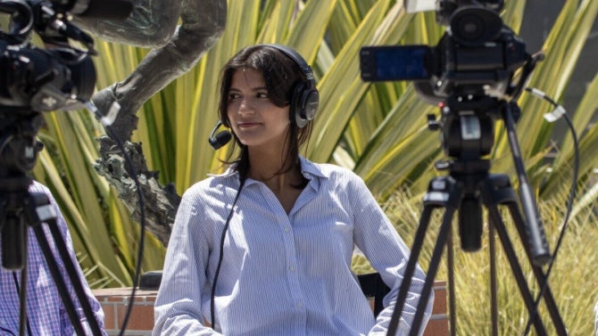Journalism student interviewing source